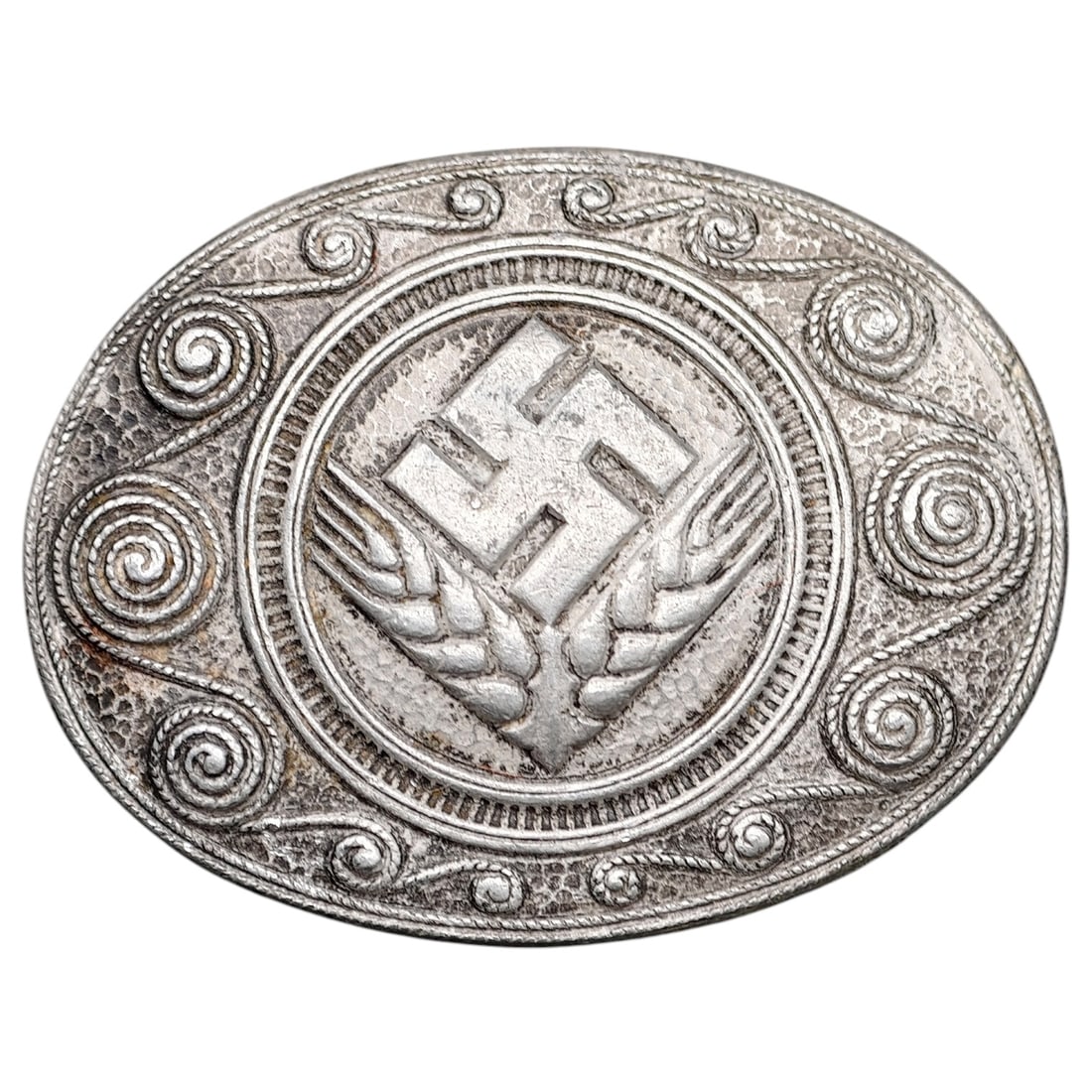 Third Reich Nazi RADwJ Brooch: Oval brooch featuring a central swastika flanked by wheat sheaves, surrounded by a hammered field with applied scrollwork/rope-twist border, typical of RAD der weiblichen Jugend (RADwJ) membership ins
