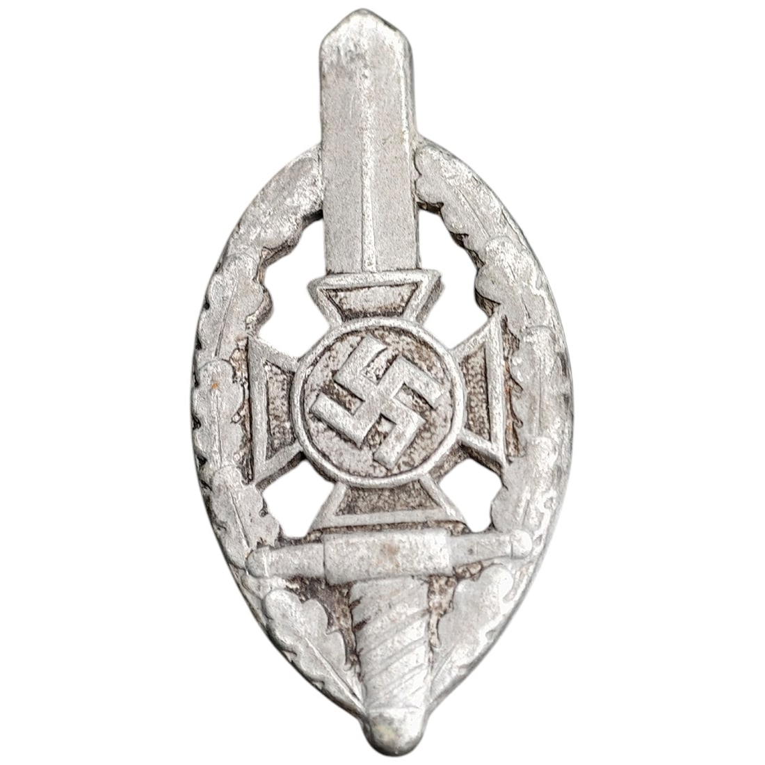 Third Reich Veterans Association Pin Badge: A miniature pin badge in the form of an oval wreath enclosing a sword, cross pattée, and mobile swastika roundel, likely worn by members of a Third Reich veterans' or ex-servicemen's association. Rev
