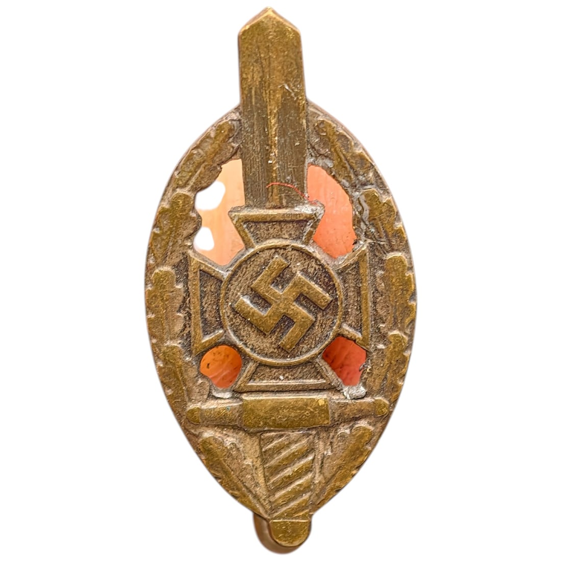 Third Reich Veterans Association Pin Badge: A miniature pin badge in the form of an oval wreath enclosing a sword, cross pattée, and mobile swastika roundel, likely worn by members of a Third Reich veterans' or ex-servicemen's association.