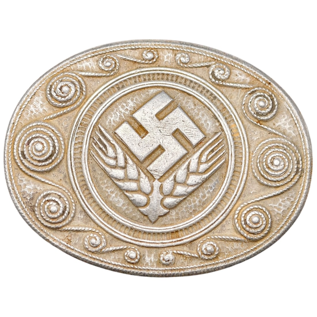 Third Reich Nazi RADwJ Brooch: Oval brooch featuring a central swastika flanked by wheat sheaves, surrounded by a hammered field with applied scrollwork/rope-twist border, typical of RAD der weiblichen Jugend (RADwJ) membership ins