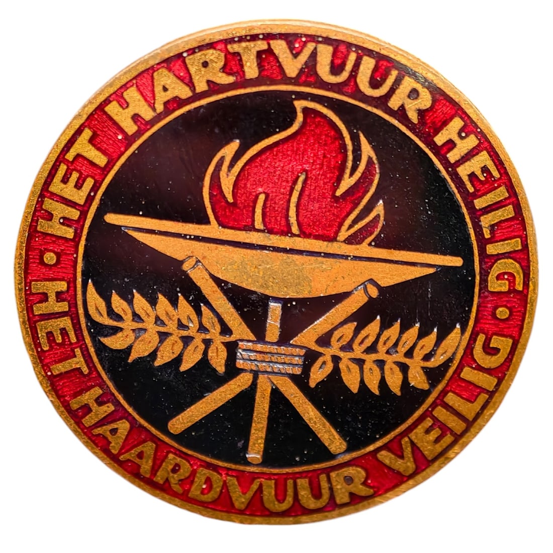 Third Reich Dutch NSVO Badge: NSVO ‘Het hartvuur heilig – Het haardvuur veilig’ Badge (Draagteken). The National Socialist Women’s Organization (NSVO) was the name under which NSB women between 1938 and 1945 could actively