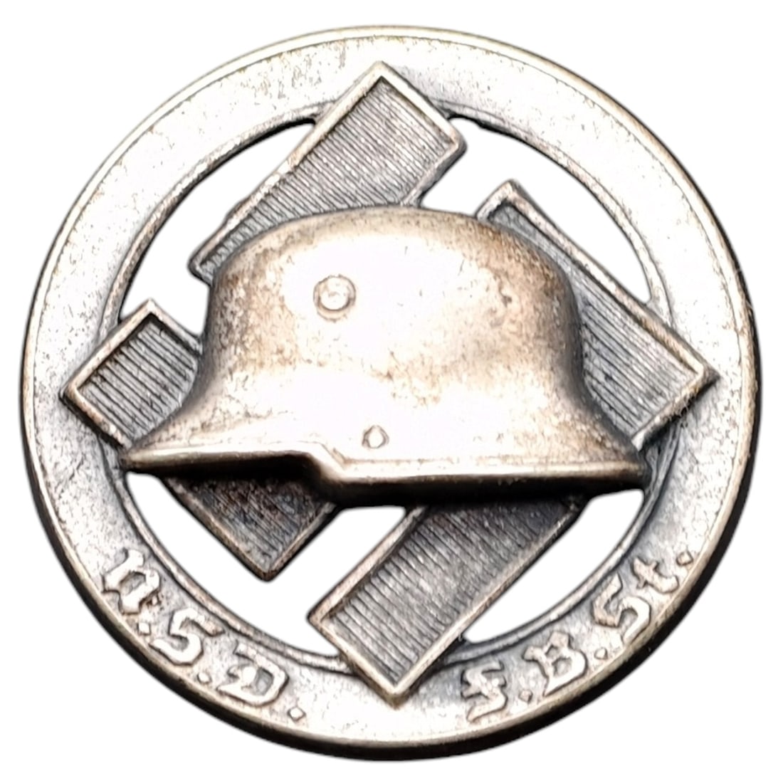 Third Reich Nazi NSD FBST Stahlhelm Pin Badge: A round pin badge featuring a stylized steel helmet (Stahlhelm) over a swastika motif, encircled by an outer ring bearing the inscription "N.S.D. F.B.St." referencing the Nationalsozialistischer