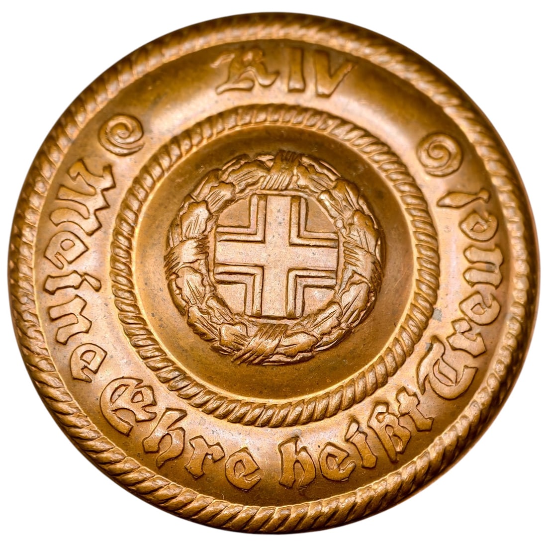 Imperial German WWI Patriotic Tinnie Badge "Meine Ehre heißt Treue": A round badge in what appears to be bronze/copper, patriotic in nature (tinnie), featuring a central Iron Cross within an oak leaf wreath. The outer border bears a rope-twist design and raised German 