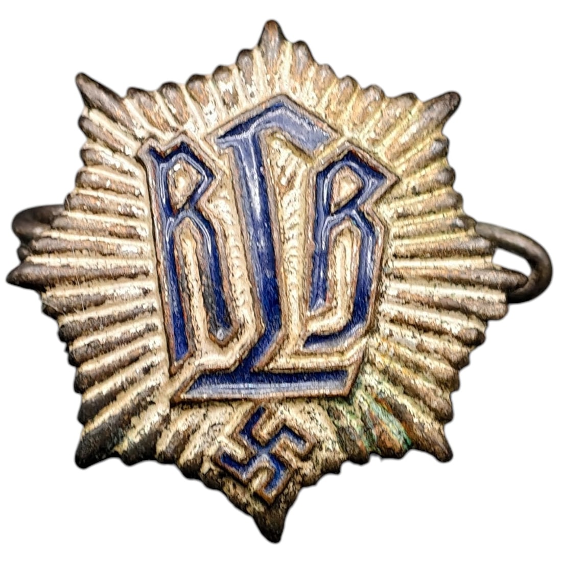 Third Reich Nazi RLB Luftschutz Pin: A starburst-form membership stickpin for the Reichsluftschutzbund (RLB - Air Raid Protection League), featuring blue enameled 'RLB' lettering over a small swastika device at the lower point.