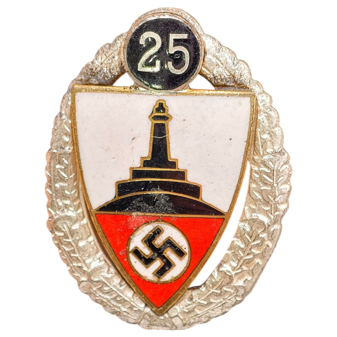 Third Reich 25 Year Veterans Association Badge: A Third Reich era Kyffhäuserbund veterans association badge marking 25 years of membership, featuring a red enameled shield with a center in what appears to be silvered Iron Cross bearing a mobile sw