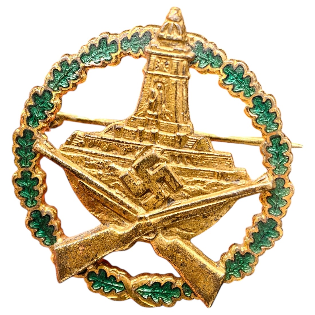 Third Reich Nazi Veterans Association Shooting Pin: A badge in what appears to be gilt tinnie-style, depicting Kyffhäuser monument tower above crossed rifles, set within an enamel oak leaf wreath in green. The reverse is plain metal in what appears to