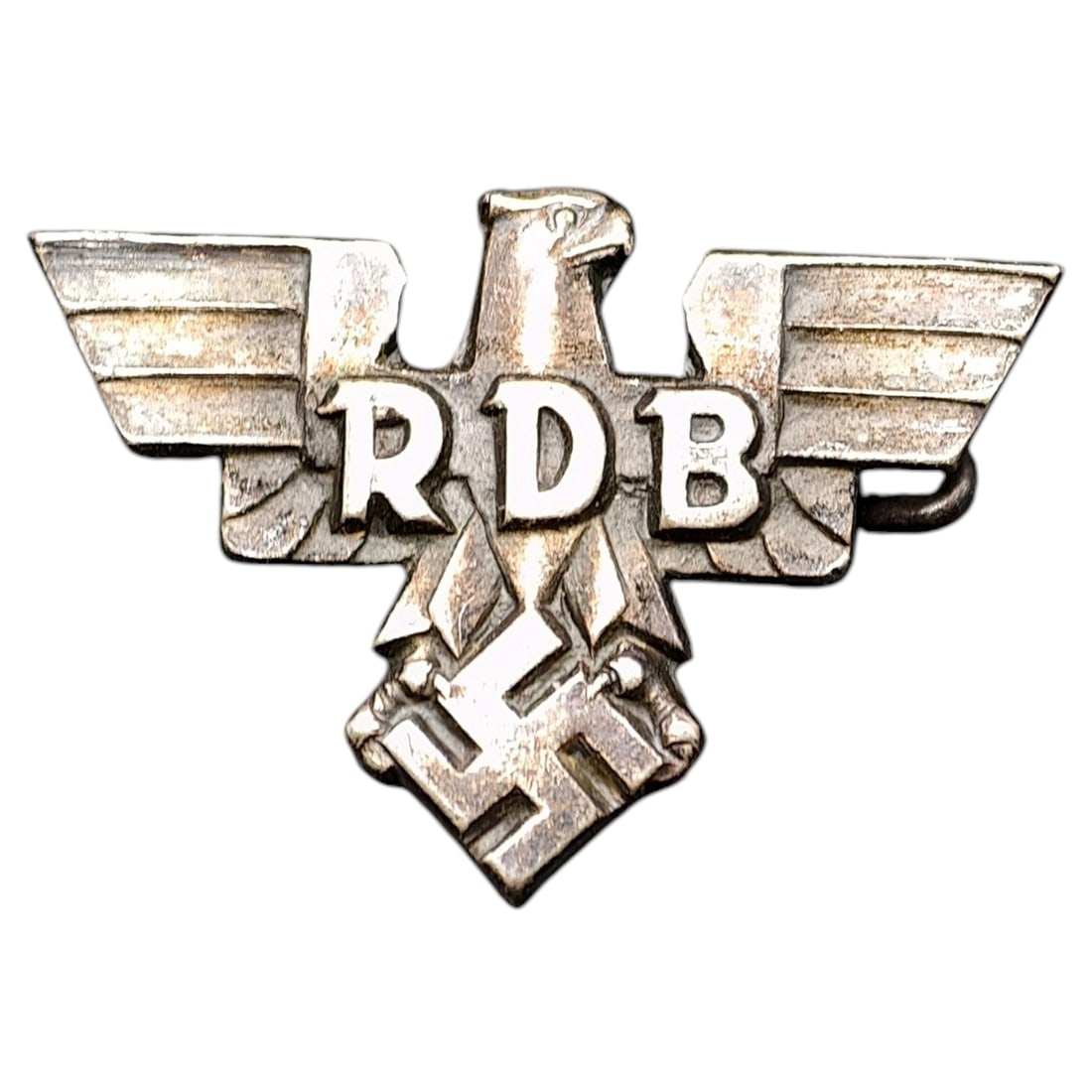 Third Reich RDB Pin: Stamped metal membership pin badge for the RDB (Reichsbund der Deutschen Beamten, League of German Civil Servants), featuring a stylized eagle with outstretched wings above a mobile swastika. Reverse 