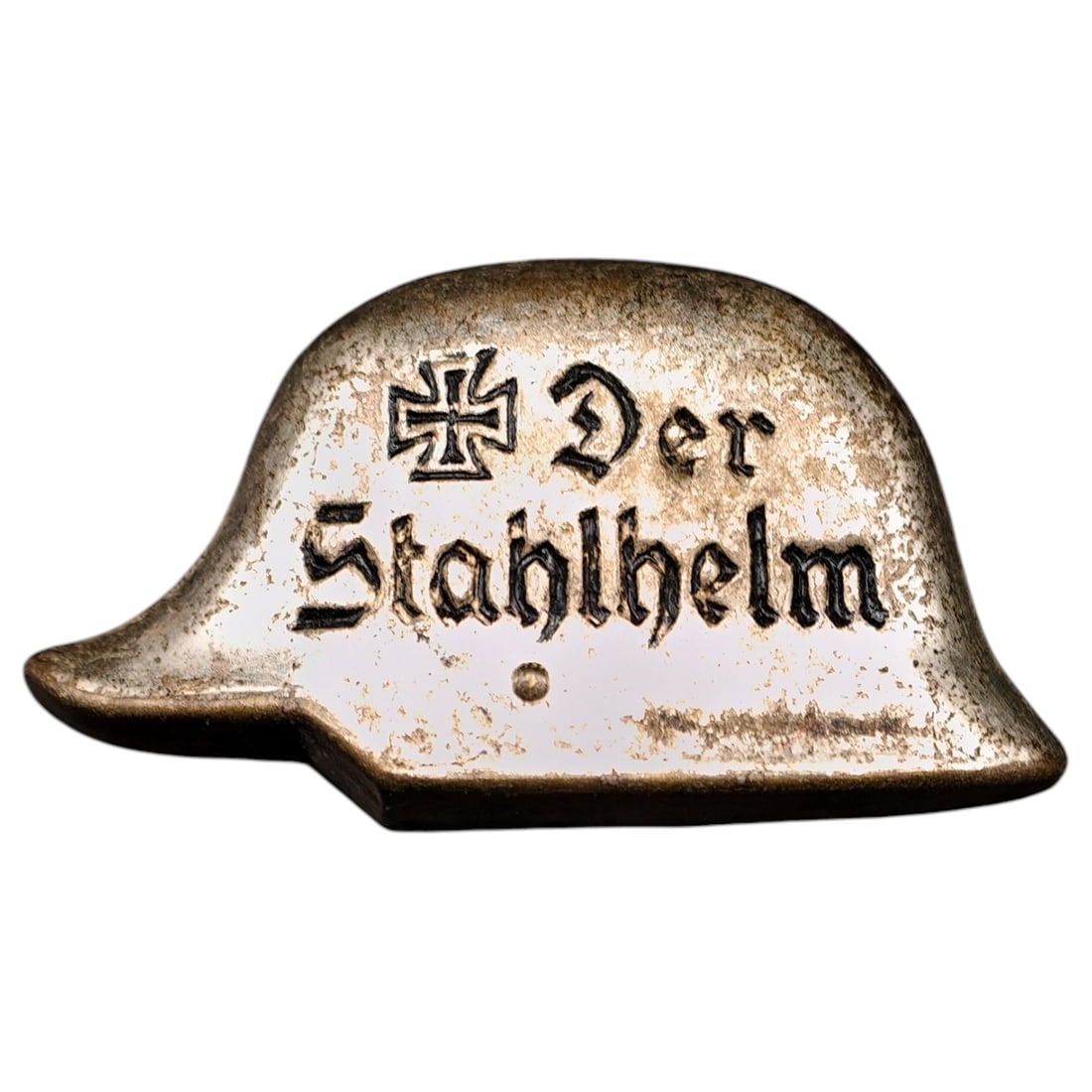 Third Reich Nazi Stahlhelm Pin Badge: A stamped metal membership pin badge in the form of a stylized steel helmet, inscribed "Der Stahlhelm" in Gothic script with an Iron Cross motif. Surface shows a gilt/bronze-toned finish.