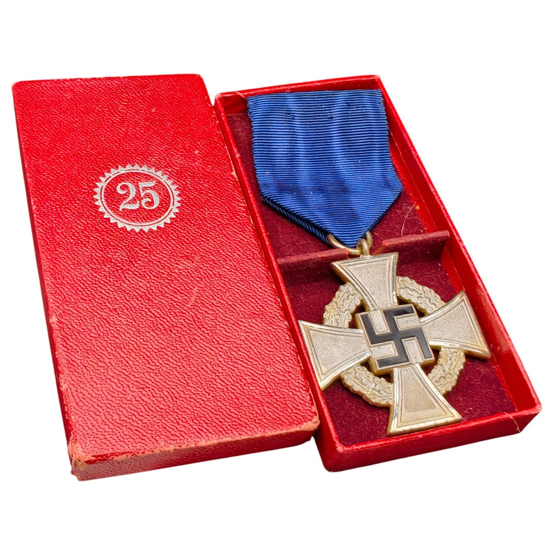 Third Reich Nazi 25 Year Faithful Service Boxed Medal: A cross-form medal in what appears to be silvered metal for 25 years of faithful service (Treudienst-Ehrenzeichen), reverse inscribed 'Für treue Dienste' within an oak leaf wreath, obverse bearing a 