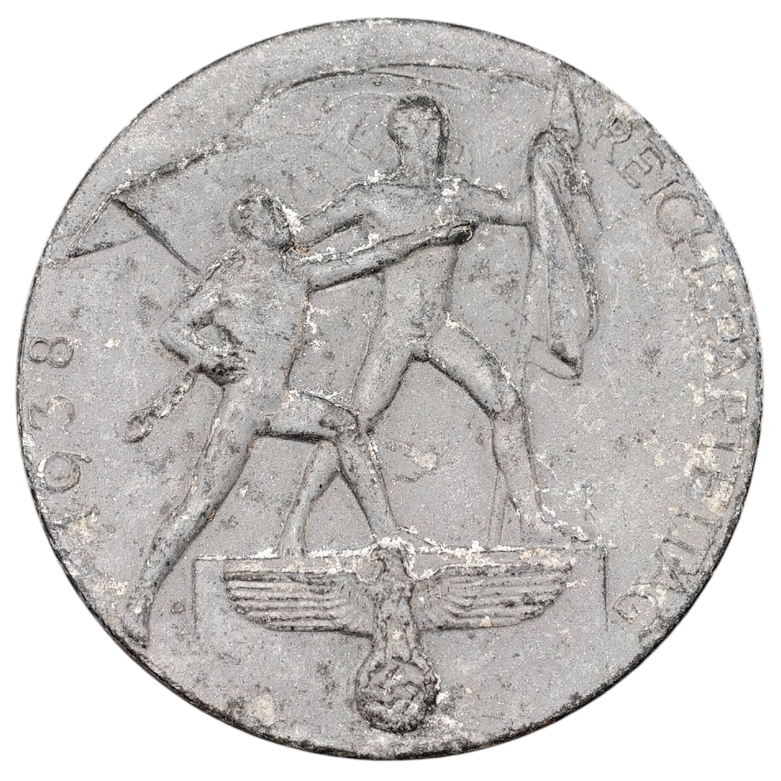 NSDAP Reichsparteitag 1938 Badge: Round tinnie badge commemorating the 1938 Reichsparteitag (Nuremberg Rally), depicting two standard-bearers with flags above an eagle-and-wreath emblem, inscribed "REICHSPARTEITAG" and dated "1938". T