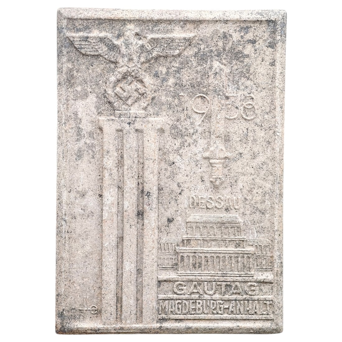 Third Reich Nazi 1938 Tinnie Badge: A tinnie (rally badge) commemorating the 1936/1938 Gautag Magdeburg-Anhalt event held in Dessau. The obverse features a Party eagle atop a stylized column, a banner reading 'DESSAU', and a depiction o