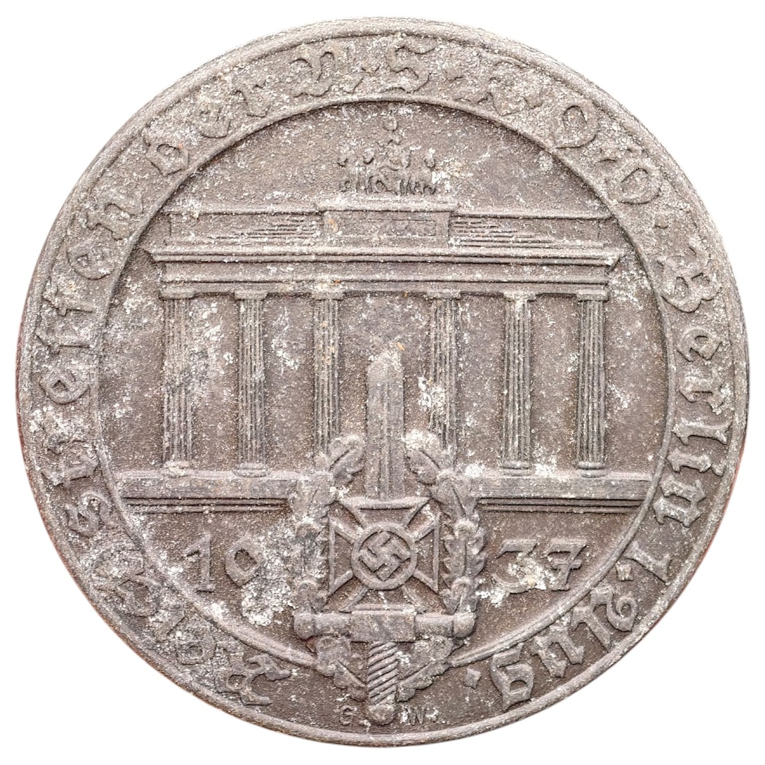 Third Reich Nazi Veterans Association Tinnie Badge: A pressed tinnie in what appears to be white metal, commemorating a 1937 veterans/political rally in Berlin, depicting the Brandenburg Gate above a crossed-sword and wreathed shield emblem dated 1937.