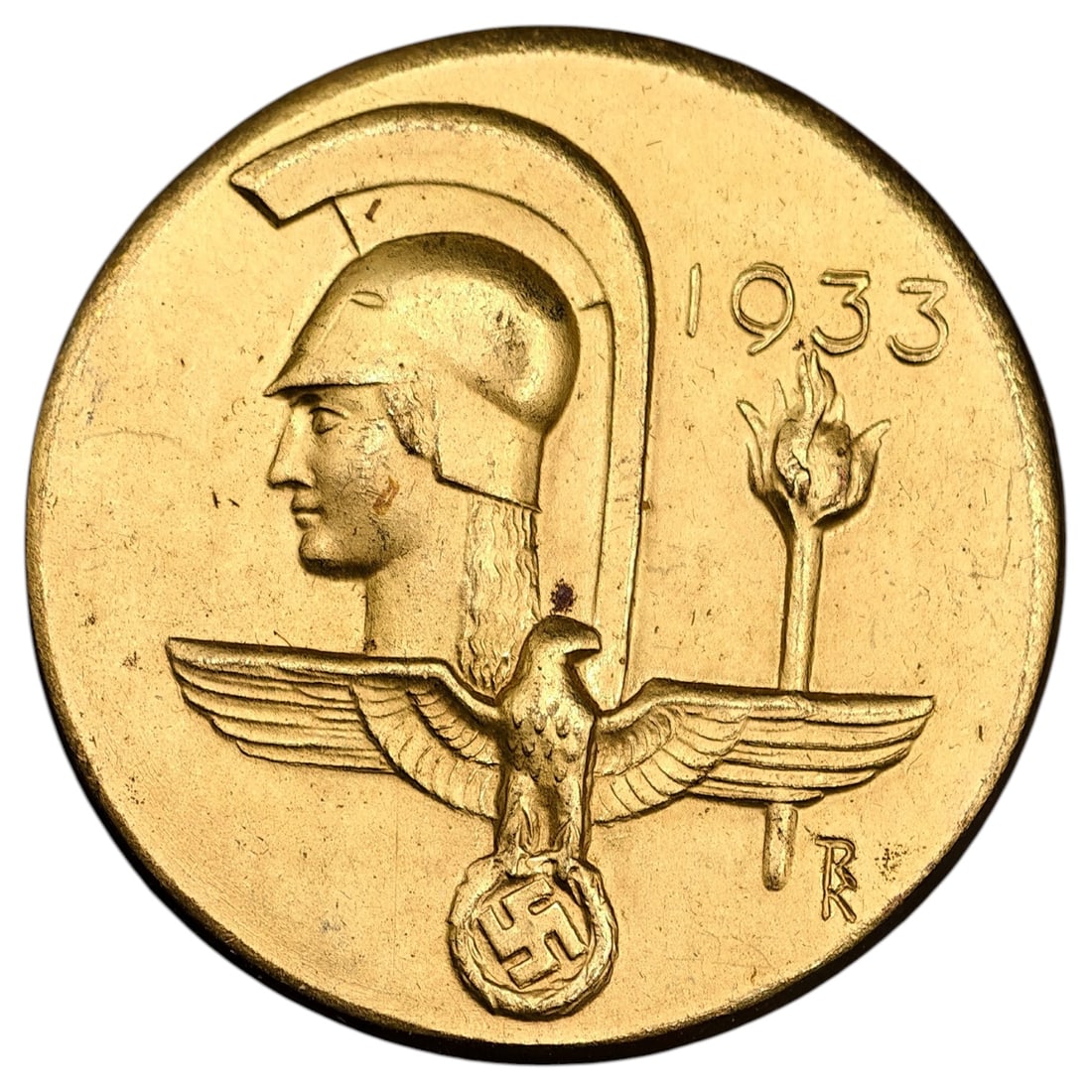 Third Reich German Art 1933 Tinnie Badge: A gilt metal commemorative tinnie badge dated 1933, depicting a helmeted classical warrior head, a Reich eagle with wings spread atop a swastika medallion, and a torch. The reverse bears the maker mar