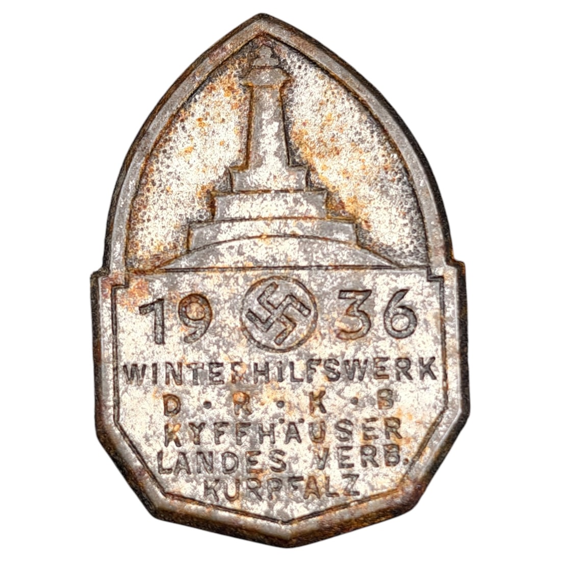 German 1936 WHW Tinnie - Kyffhäuser D.R.K.B. Kurpfalz District: A stamped metal donation badge (Winterhilfswerk pin/tinnie) dated 1936, inscribed 'WINTERHILFSWERK D.R.K.B. KYFFHAUSER LANDES VERB. KURPFALZ' with a central swastika emblem and depiction of the Kyffh�