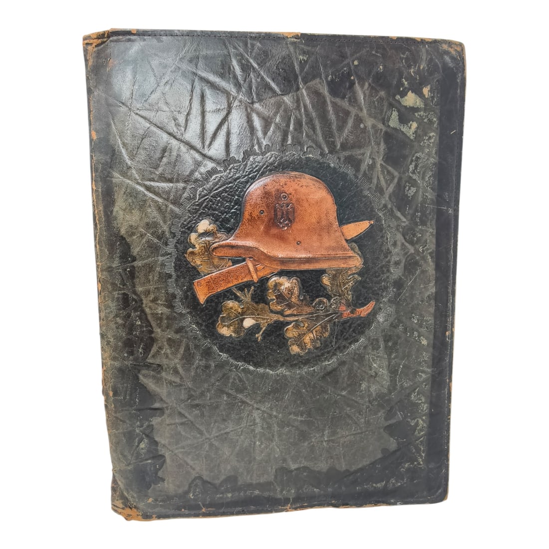 Third Reich Stahlhelm Leather Officer Folder Portfolio: A black leather document folder or photo album cover featuring an embossed decorative panel depicting a German steel helmet (Stahlhelm), crossed rifle, oak leaves, and acorns. No visible maker's
