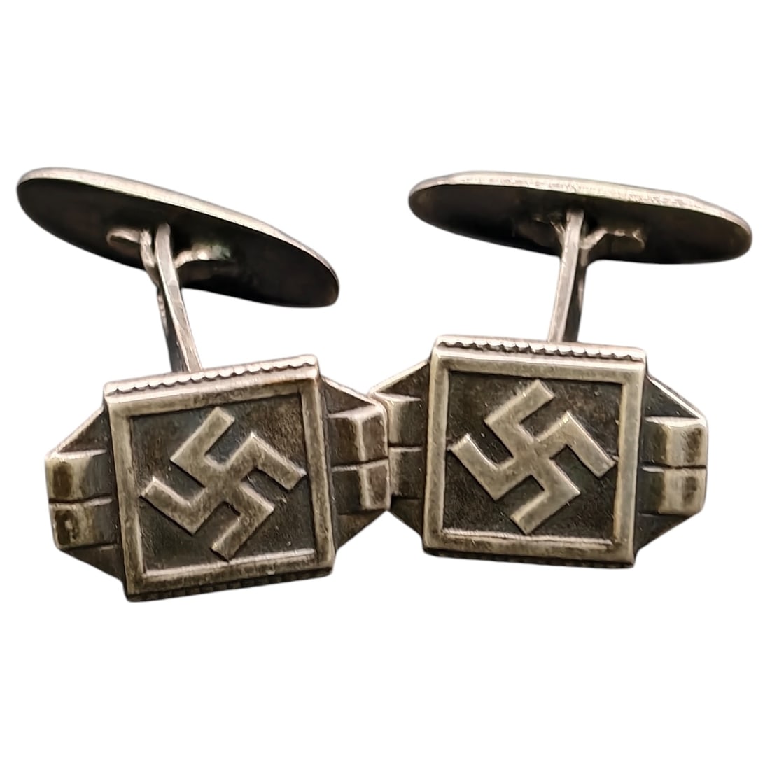 Third Reich Nazi NSDAP Cufflinks 925 Silver: A pair of period cufflinks with rectangular faces bearing a raised swastika motif within a beaded border. The reverse of each face is stamped '925' indicating what appears to be sterling silver conten