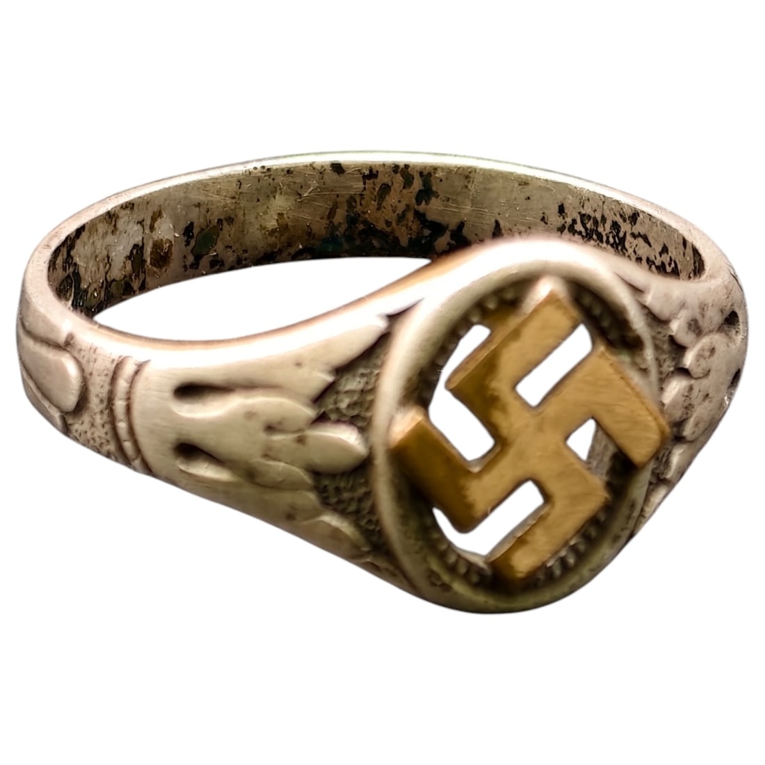 Third Reich NSDAP Nazi Sympathizer Ring 800 Silver: A ring in what appears to be silver, signet-style, with foliate scroll and berry motifs decorating the shoulders, centered by a raised oval bezel featuring an applied emblem believed to be gilt-toned