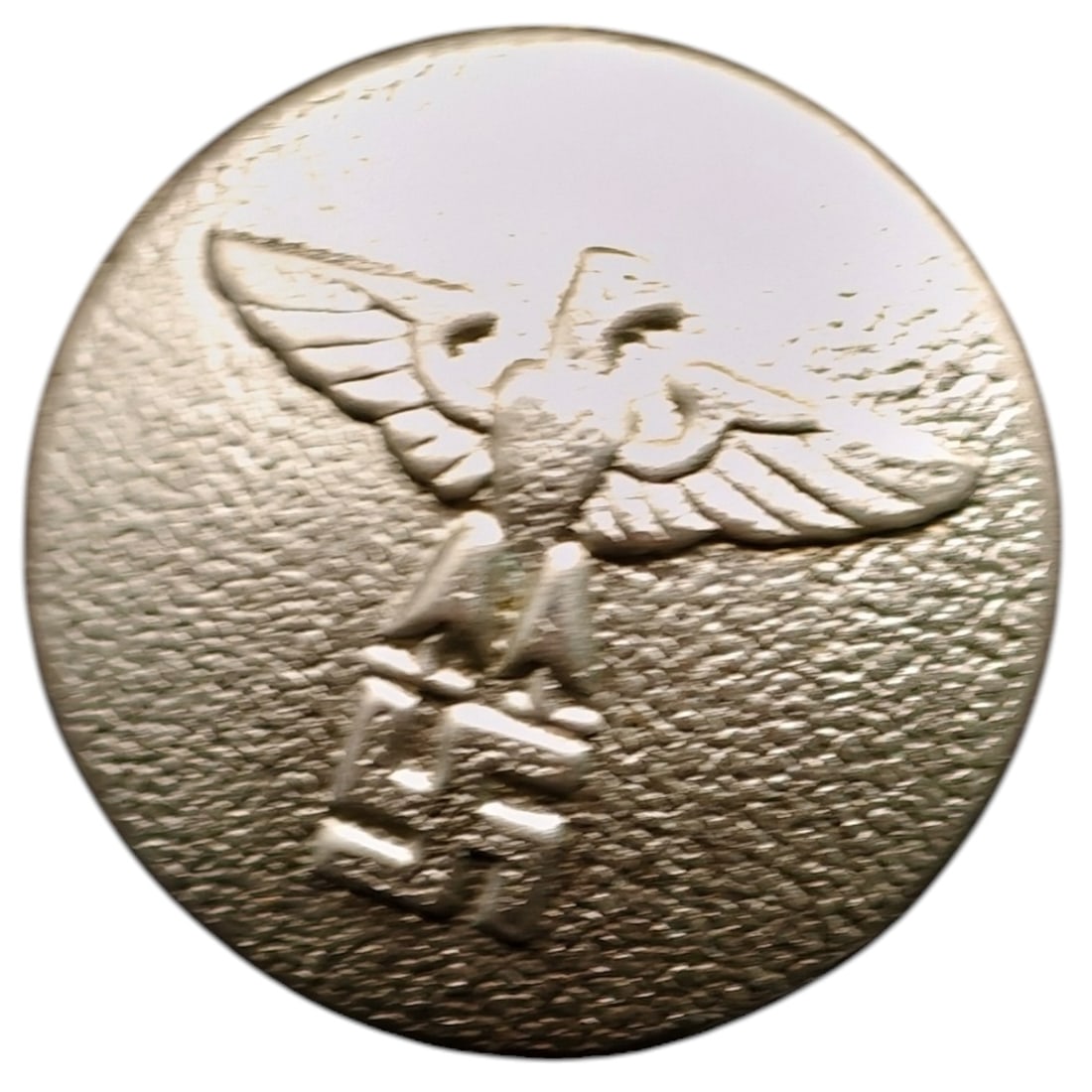 German WWII NSDAP Eagle Uniform Button: A domed metal uniform button featuring a raised Parteiadler (party eagle) atop a mobile swastika, as used on NSDAP or affiliated organization tunics. The reverse shows a threaded/shank fitting with
