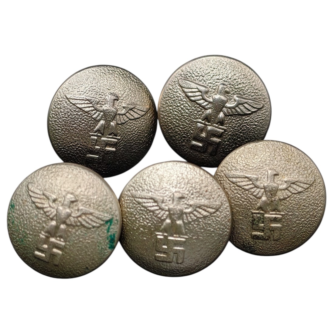 German WWII Third Reich Eagle Tunic Buttons - Set: A set of aluminum tunic buttons featuring the NSDAP/Party-style eagle with wings spread atop a swastika, in raised relief on a pebbled ground. Reverse sides show maker/quality marks including "EXTRA"