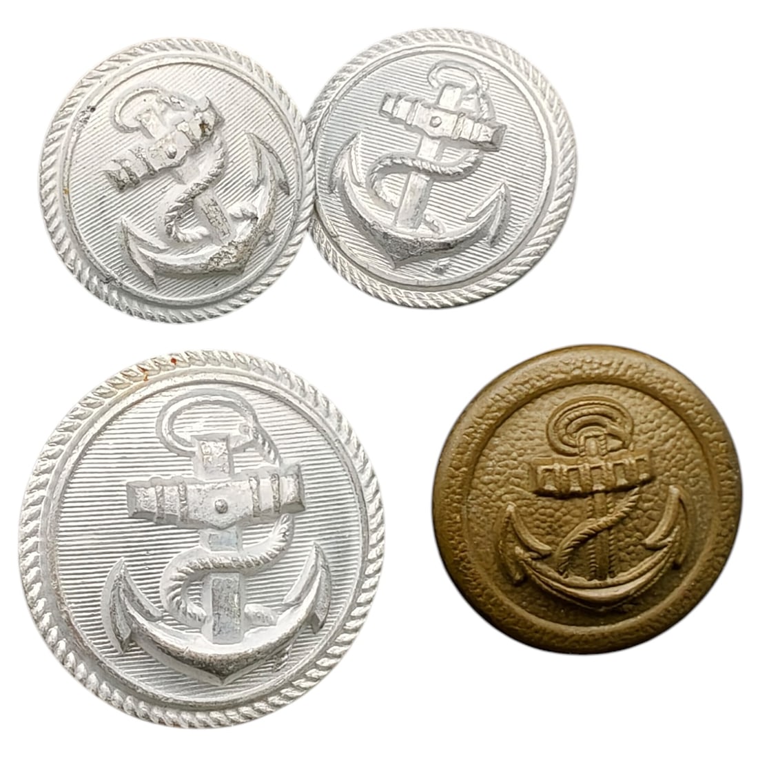 German WWII Kriegsmarine Uniform Anchor Buttons, Set: Set of naval uniform buttons featuring the fouled anchor motif within a roped border, worn by Kriegsmarine (and possibly earlier Reichsmarine/Imperial) personnel. The buttons are of a light metal in w