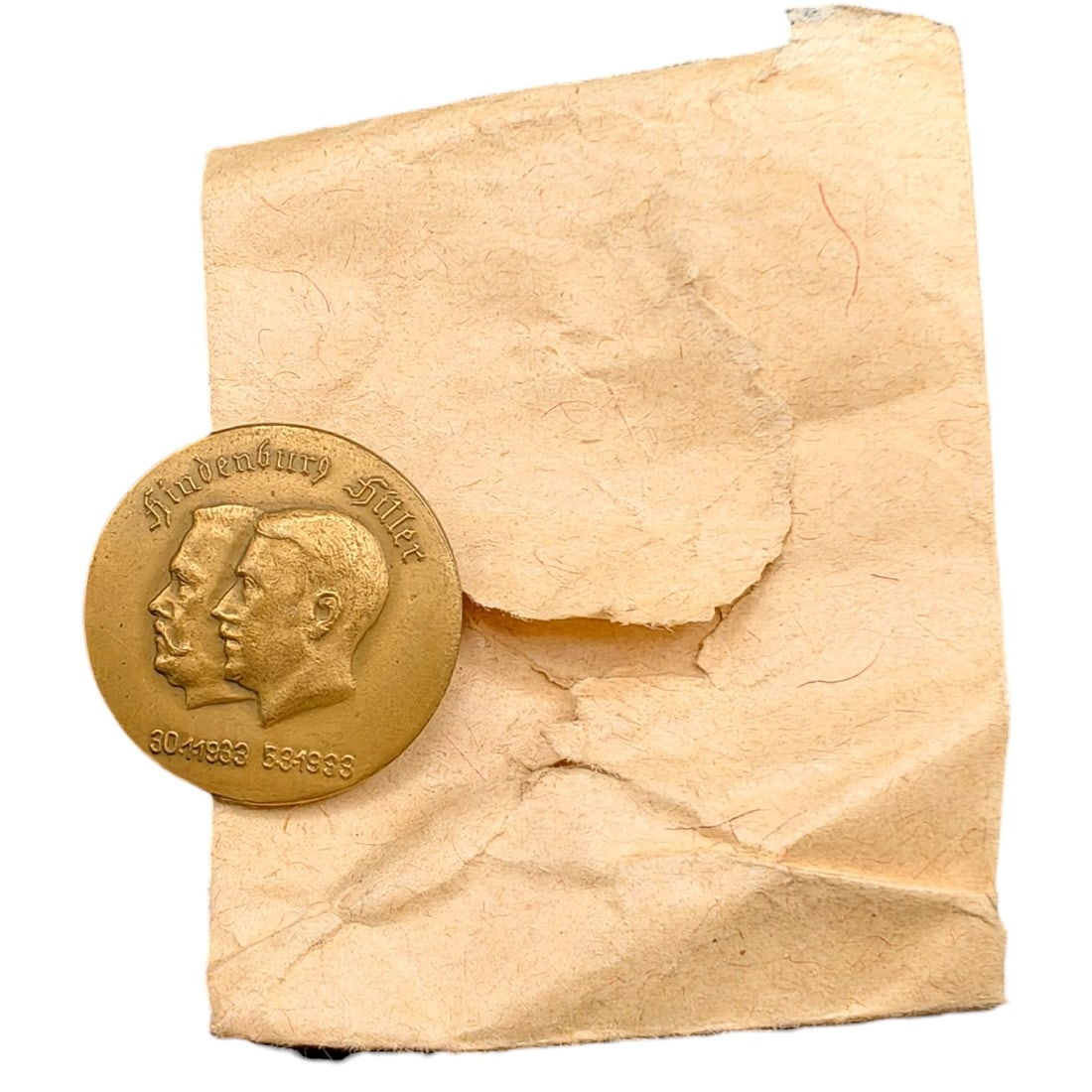 Adolf Hitler Hindenburg Commemorative Badge with Envelope: A round tinnie-style commemorative badge depicting the conjoined profiles of Paul von Hindenburg and Adolf Hitler, inscribed 'Hindenburg Hitler' above and dated '30.1.1933' and '5.3.1933' below, marki