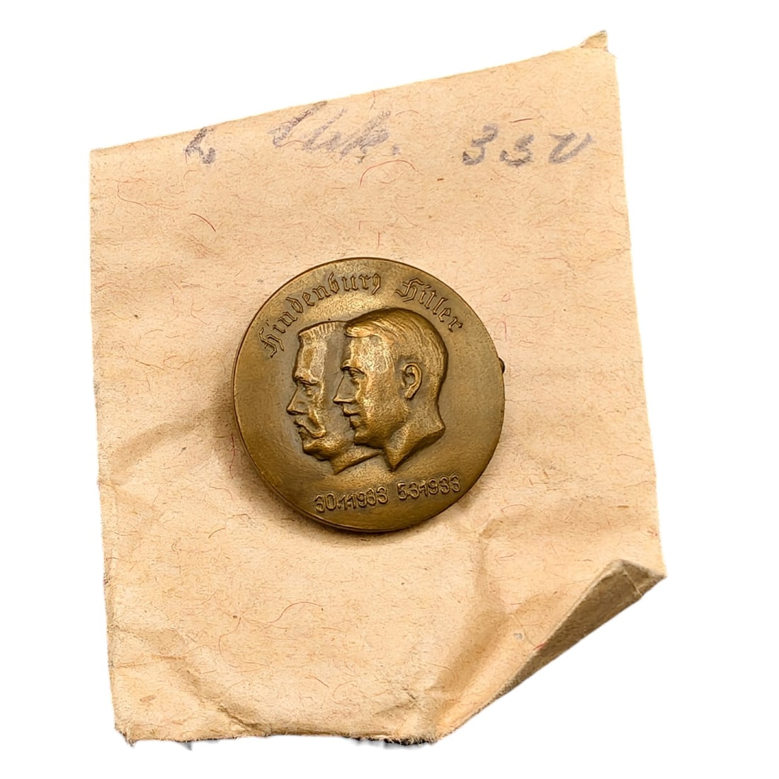 Adolf Hitler Hindenburg Commemorative Badge with Envelope: A round tinnie-style commemorative badge depicting the conjoined profiles of Paul von Hindenburg and Adolf Hitler, inscribed 'Hindenburg Hitler' above and dated '30.1.1933' and '5.3.1933' below, marki