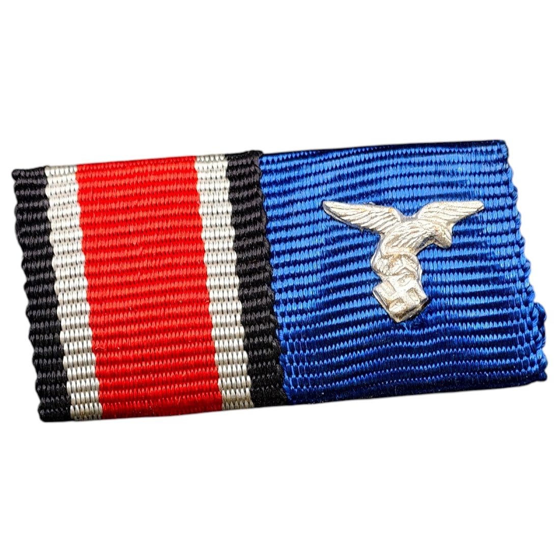 Third Reich Nazi 2 Place Ribbon Bar: A two-place ribbon bar mounted on a stiffened backing. The first ribbon is the black-white-red Iron Cross 2nd Class combat ribbon. The second is the blue Luftwaffe Dienstauszeichnung (long service) ri