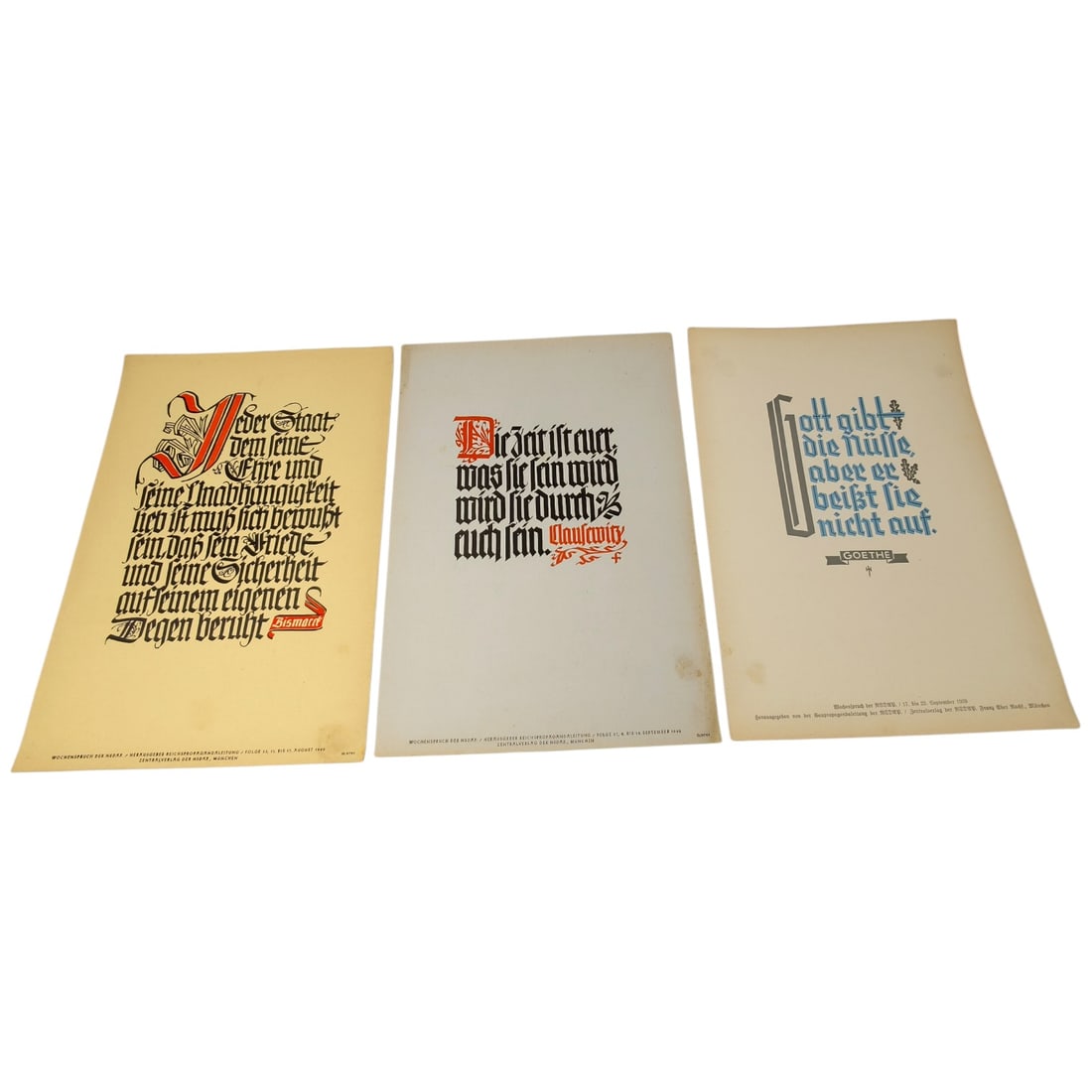German WWII Wochenspruch der NSDAP Weekly Slogan Sheets - Set: A set of printed weekly slogan sheets (Wochenspruch der NSDAP), each featuring a quotation attributed to historical German figures (Friedrich der Große, Gorch Fock, and Ulrich von Hutten) with styliz
