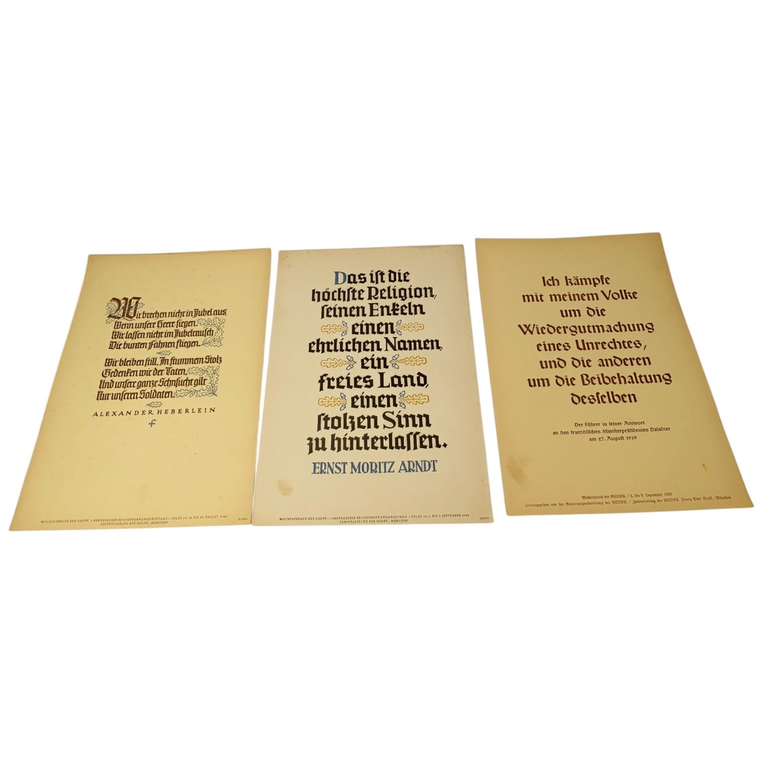 German WWII Wochenspruch der NSDAP Weekly Slogan Sheets - Set: A set of printed weekly slogan sheets (Wochenspruch der NSDAP), each featuring a quotation attributed to historical German figures (Friedrich der Große, Gorch Fock, and Ulrich von Hutten) with styliz