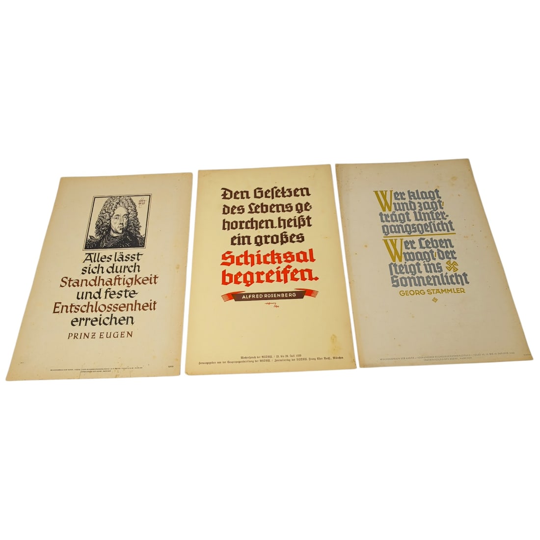 German WWII Wochenspruch der NSDAP Weekly Slogan Sheets - Set: A set of printed weekly slogan sheets (Wochenspruch der NSDAP), each featuring a quotation attributed to historical German figures (Friedrich der Große, Gorch Fock, and Ulrich von Hutten) with styliz