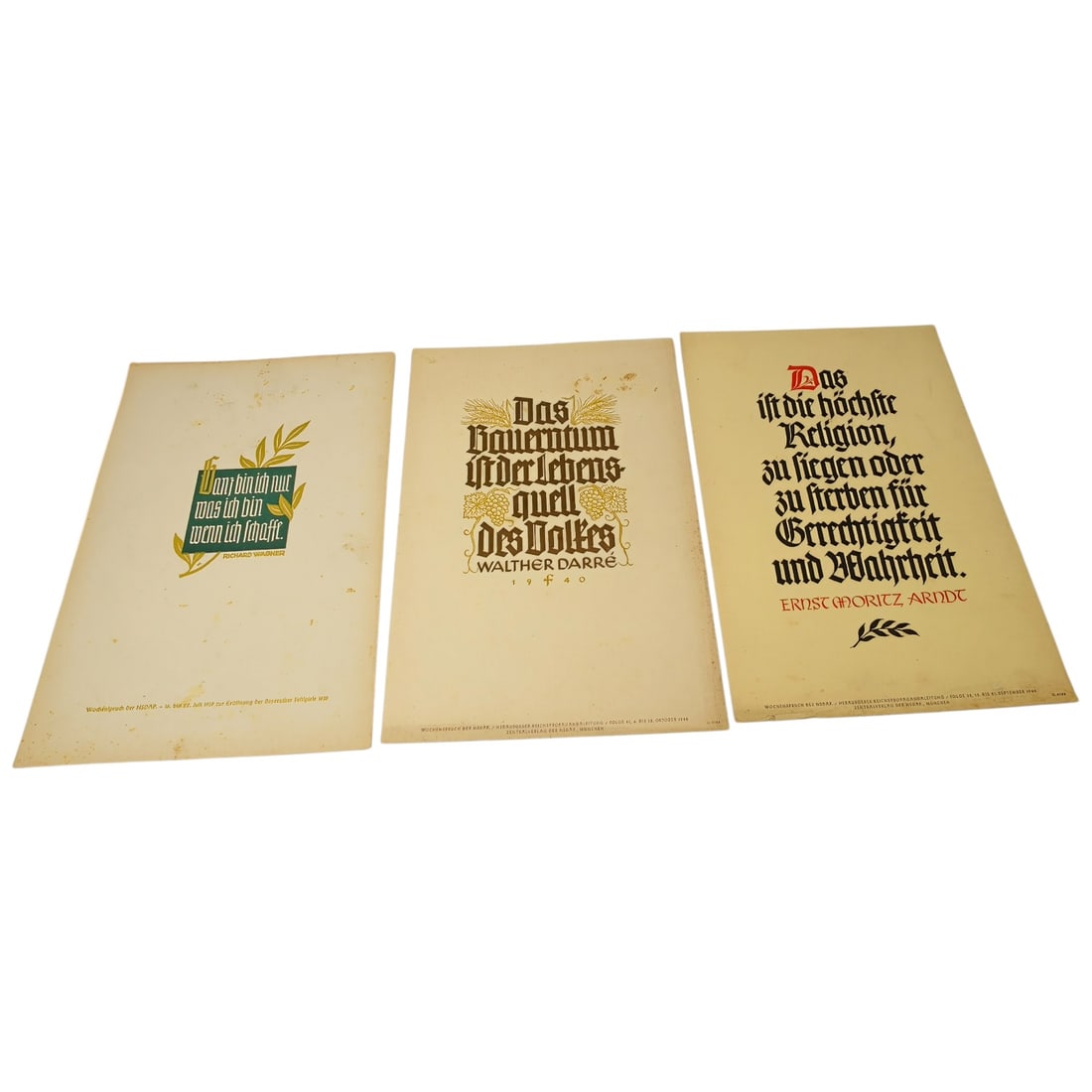 German WWII Wochenspruch der NSDAP Weekly Slogan Sheets - Set: A set of printed weekly slogan sheets (Wochenspruch der NSDAP), each featuring a quotation attributed to historical German figures (Friedrich der Große, Gorch Fock, and Ulrich von Hutten) with styliz