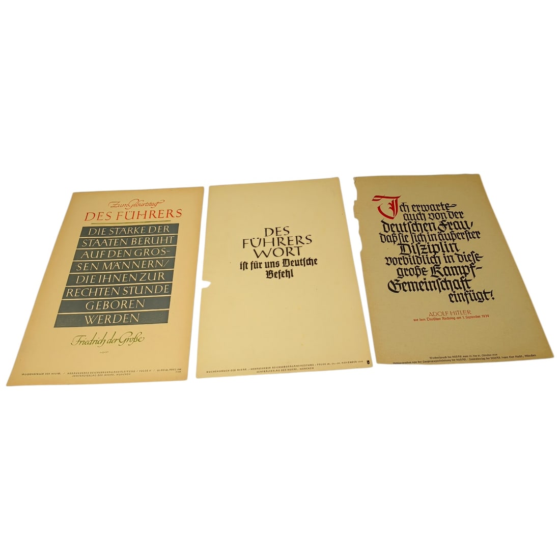 German WWII Wochenspruch der NSDAP Weekly Slogan Sheets - Set: A set of printed weekly slogan sheets (Wochenspruch der NSDAP), each featuring a quotation attributed to historical German figures (Friedrich der Große, Gorch Fock, and Ulrich von Hutten) with styliz