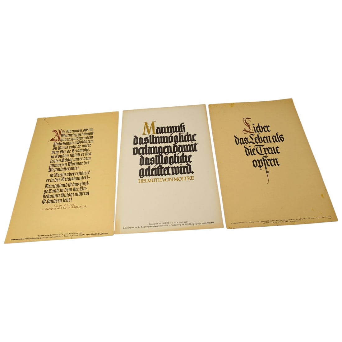 German WWII Wochenspruch der NSDAP Weekly Slogan Sheets - Set: A set of printed weekly slogan sheets (Wochenspruch der NSDAP), each featuring a quotation attributed to historical German figures (Friedrich der Große, Gorch Fock, and Ulrich von Hutten) with styliz