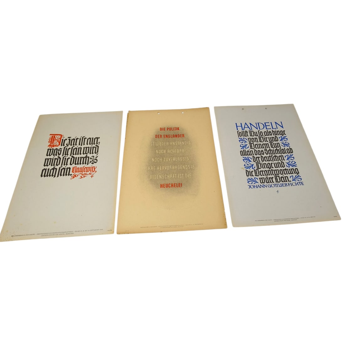German WWII Wochenspruch der NSDAP Weekly Slogan Sheets - Set: A set of printed weekly slogan sheets (Wochenspruch der NSDAP), each featuring a quotation attributed to historical German figures (Friedrich der Große, Gorch Fock, and Ulrich von Hutten) with styliz