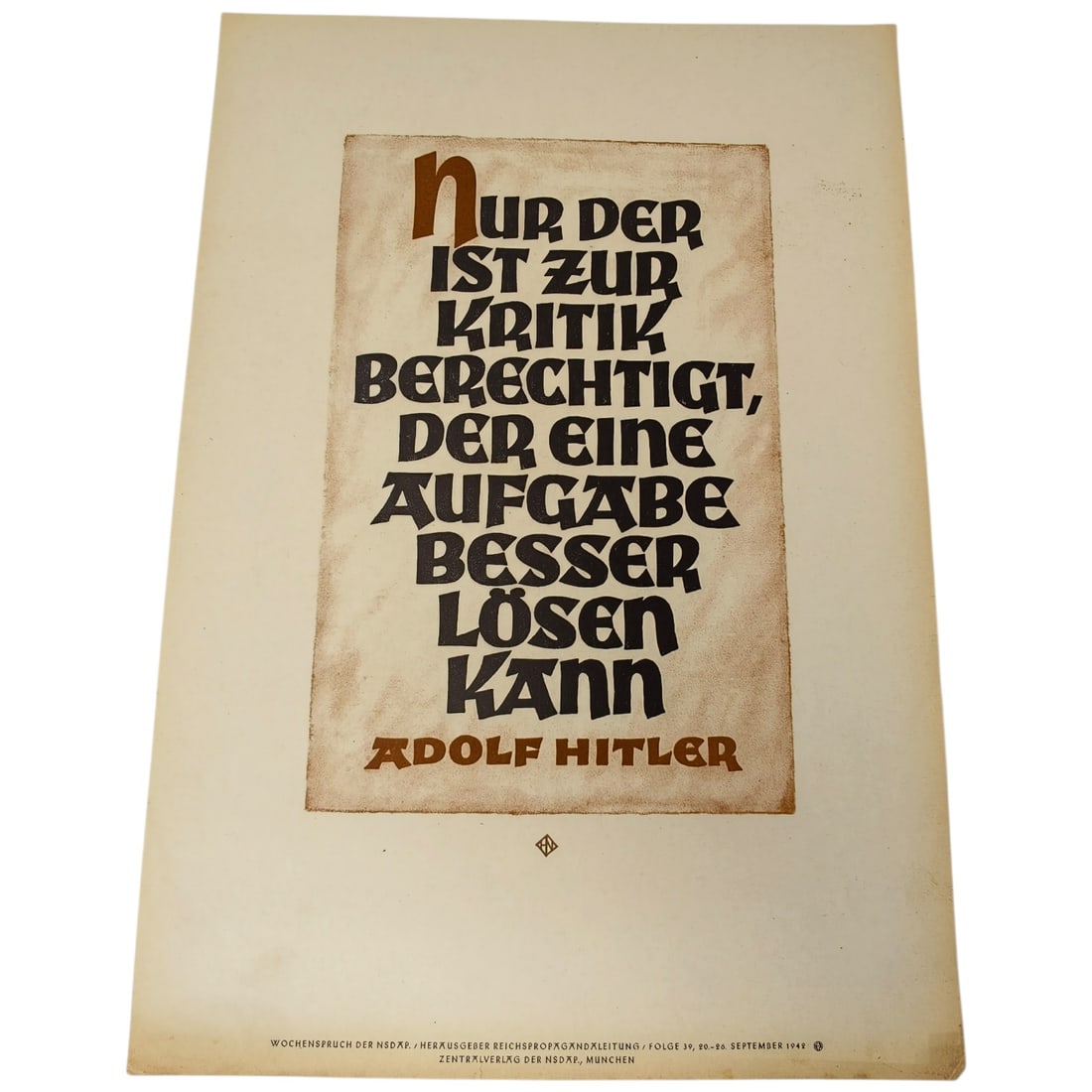 German WWII NSDAP 'Wochenspruch' Propaganda Sheet with Hitler Quote: A printed weekly propaganda page (Wochenspruch der NSDAP) featuring a quotation attributed to Adolf Hitler in stylized Fraktur-style lettering, printed in black and brown ink on tan paper. Lower margi