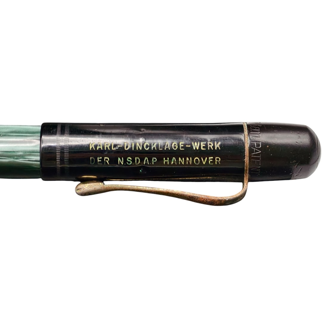 German 1930s Fountain Pen Marked "Karl-Dincklage-Werk der NSDAP Hannover": A vintage fountain pen with a green marbled celluloid barrel and black cap, gilt-inscribed cap band reading "KARL-DINCKLAGE-WERK DER N.S.D.A.P HANNOVER." The cap features a spring clip in what appears