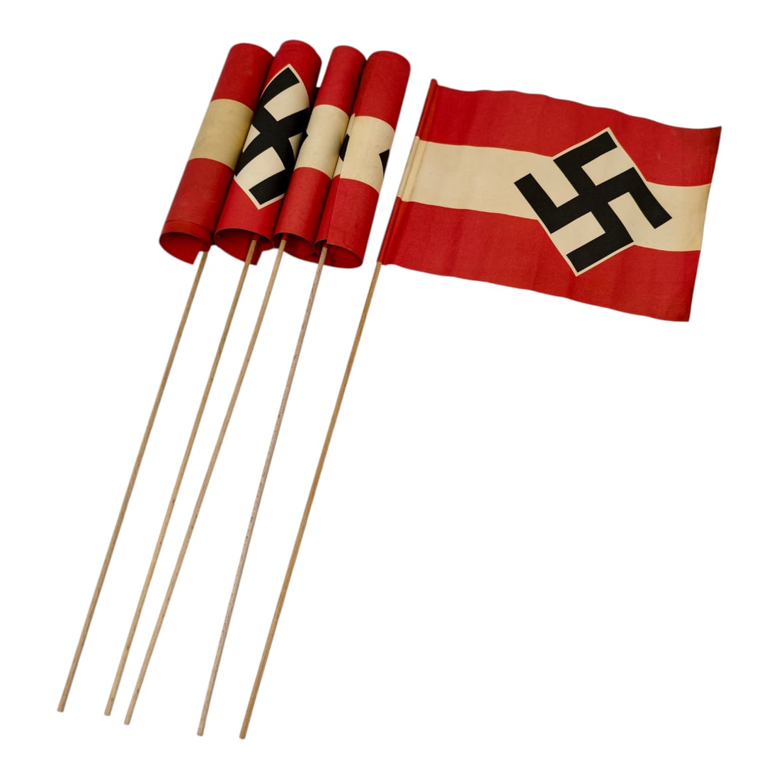 Hitler Youth Paper Flags - Set: A set of small paper parade flags, each printed with red-white-red bands and central black swastika emblem, mounted on thin wooden dowel sticks. Flags appear machine-printed on lightweight paper