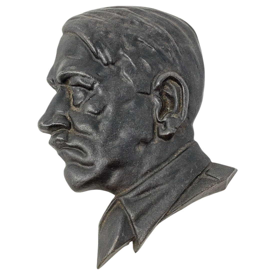 Cast Metal Relief Plaque Depicting Adolf Hitler: A cast metal wall plaque depicting Hitler in relief, wearing a collared jacket. No visible maker's marks or stamps are present in the photos.