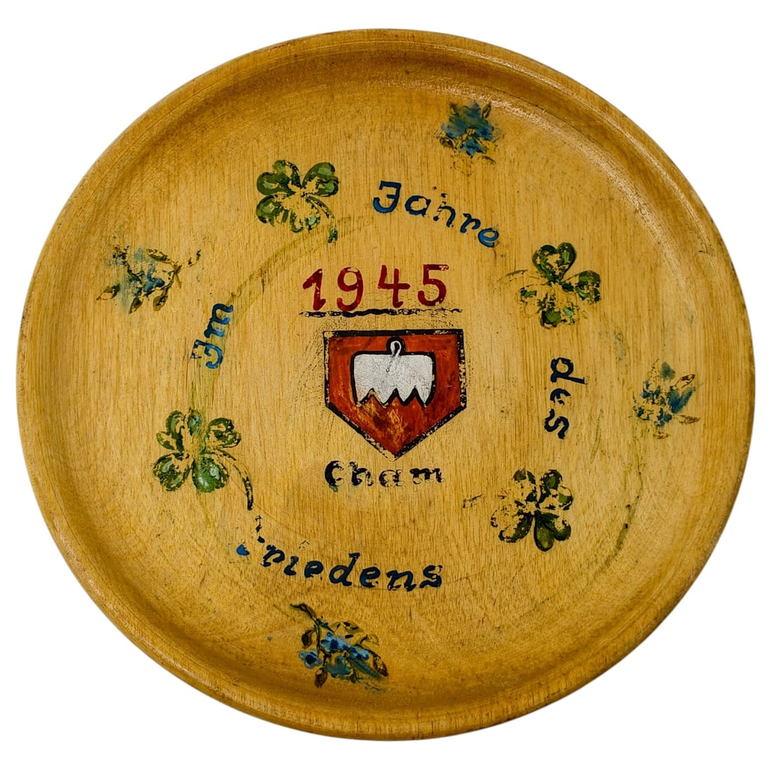 German 1945 Painted Wooden Commemorative Plate "Im Jahre des Friedens" - Cham: A turned wooden plate hand-painted with the date "1945" and the phrase "Im Jahre des Friedens" (In the Year of Peace), commemorating the town of Cham with its heraldic shield showing a mountain and ho