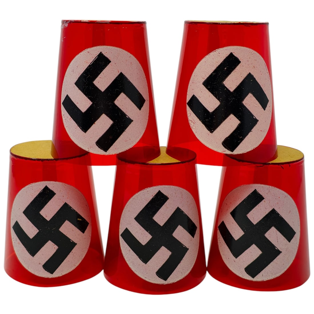 Third Reich Nazi Candle Cups - Set: A set of red translucent candle cup covers, each with an applied swastika emblem in black on a white/pink oval field. Constructed of a thin material believed to be cellulose or similar