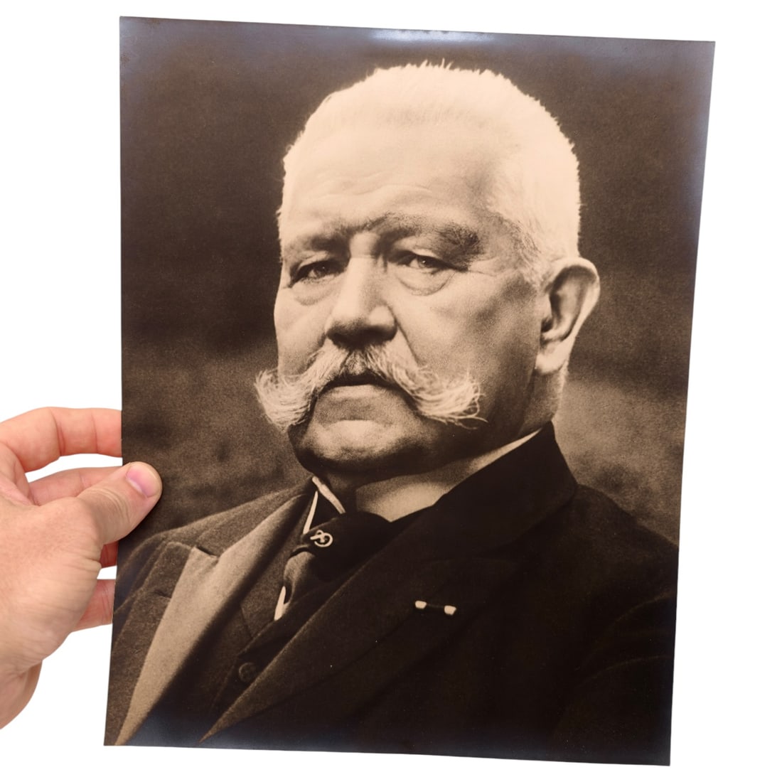 HUGE Paul von Hindenburg Heinrich Hoffmann Portrait Photograph: A large sepia-toned photographic print portraying German President Paul von Hindenburg in formal attire, shown in a head-and-shoulders pose wearing a suit, tie pin, and pince-nez suspended from a