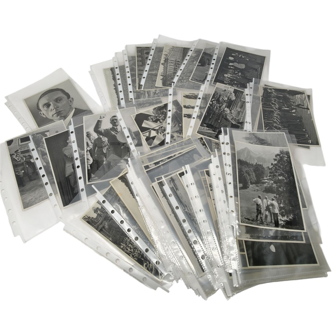 Third Reich Nazi Cigarette Card Grouping: A large lot of vintage black and white cig cards, each housed in individual archival plastic sleeves, depicting various subjects including portraits, group scenes, landscapes, and what appear to be Na