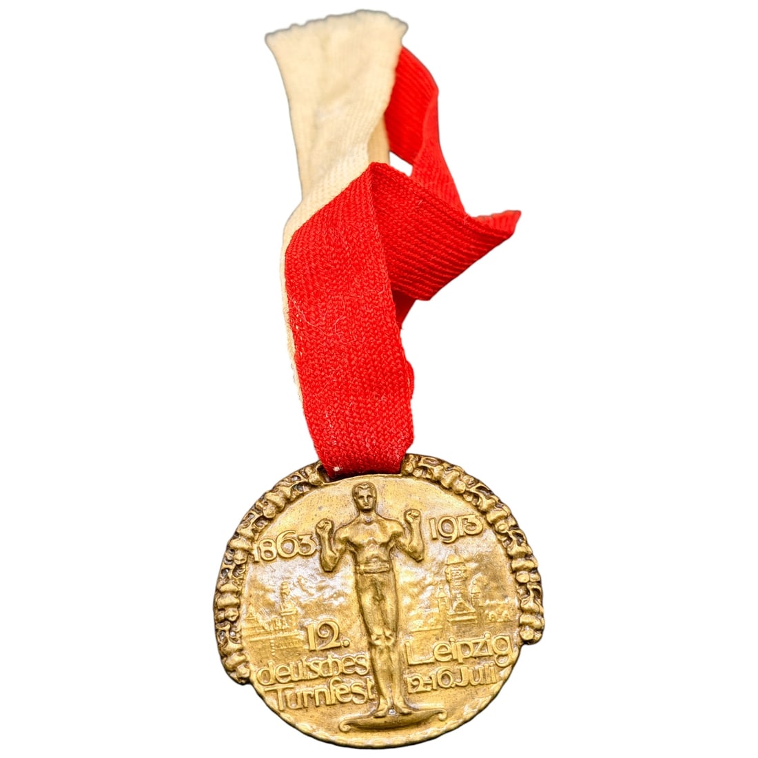 German 1913 12th Deutsches Turnfest Leipzig Commemorative Medal: A commemorative medal in bronze-toned metal, marked "1863" and "1913" flanking a standing male gymnast figure, with the inscription "12. deutsches Turnfest Leipzig 9.-10.Juli" around the lower edge. S