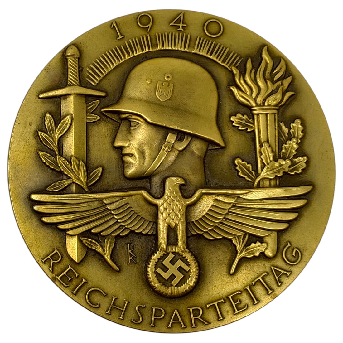 German 1940 Reichsparteitag Table Medal: A large table medal marked "1940" and "REICHSPARTEITAG" around the border, depicting a helmeted soldier's profile above an eagle clutching a wreathed swastika, flanked by a sword and laurel branch on 