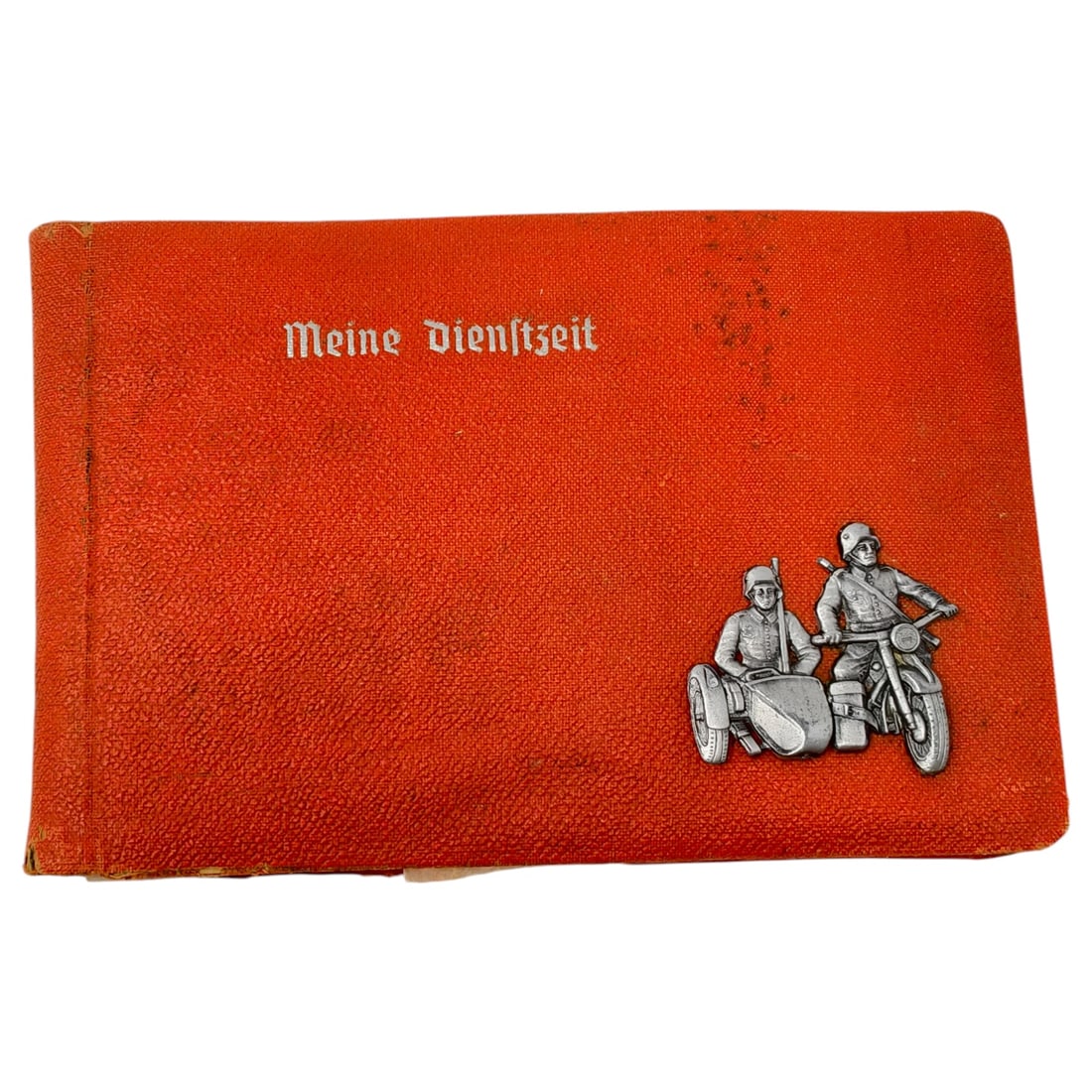 German WWII "Meine Dienstzeit" Photo Album with Motorcycle Sidecar Troop Motif: Heavily water damaged with only a few pictures. A personal service-period photograph album with cloth covers in orange, titled in Fraktur script "Meine Dienstzeit" ("My Time of Service"). The cover be