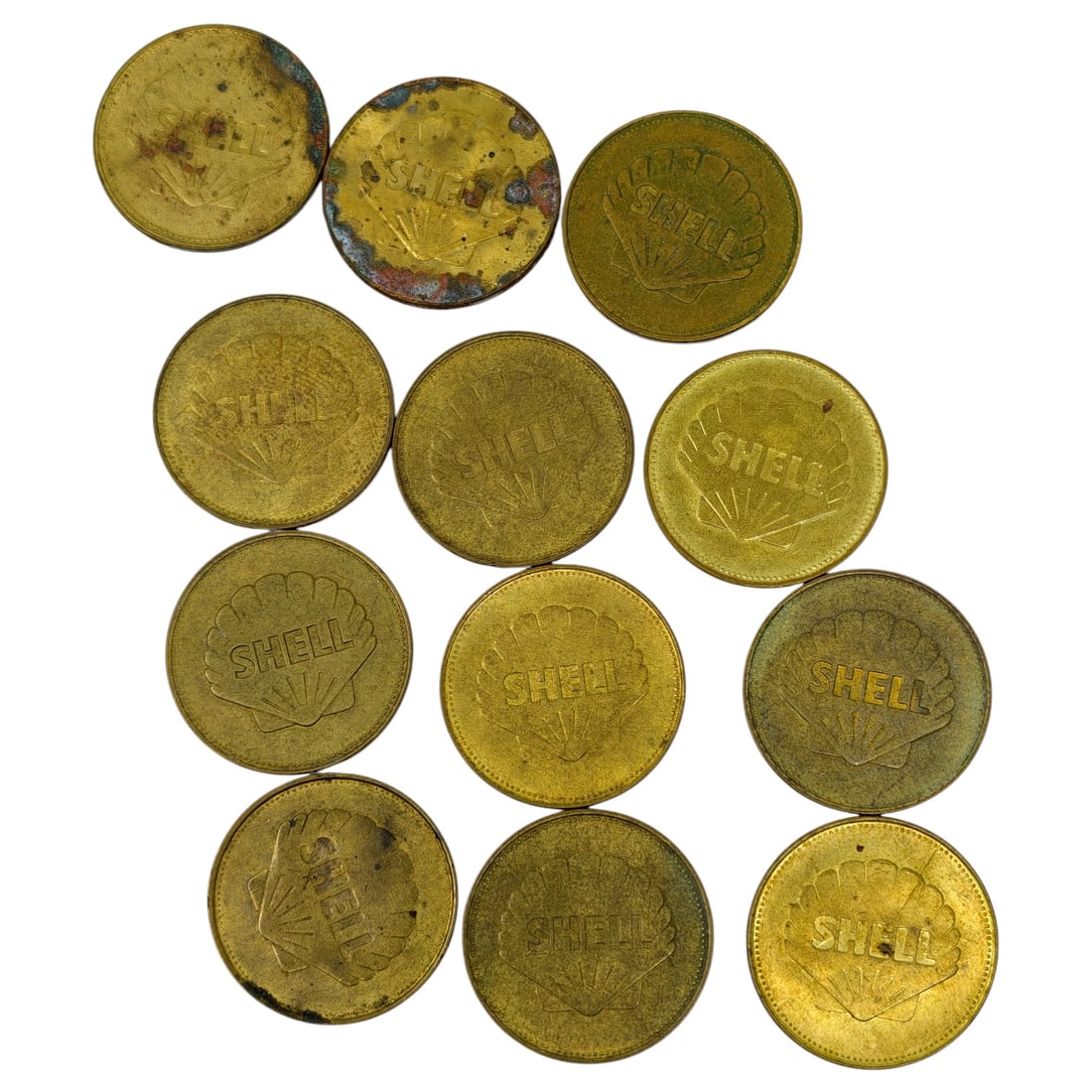 Set of Shell Oil "Famous Aviators" Advertising Tokens: A set of brass-toned tokens issued by Shell Oil, each stamped on one face with the SHELL name and shell-logo emblem. The reverse of each token commemorates a pioneer of aviation and aerospace history,