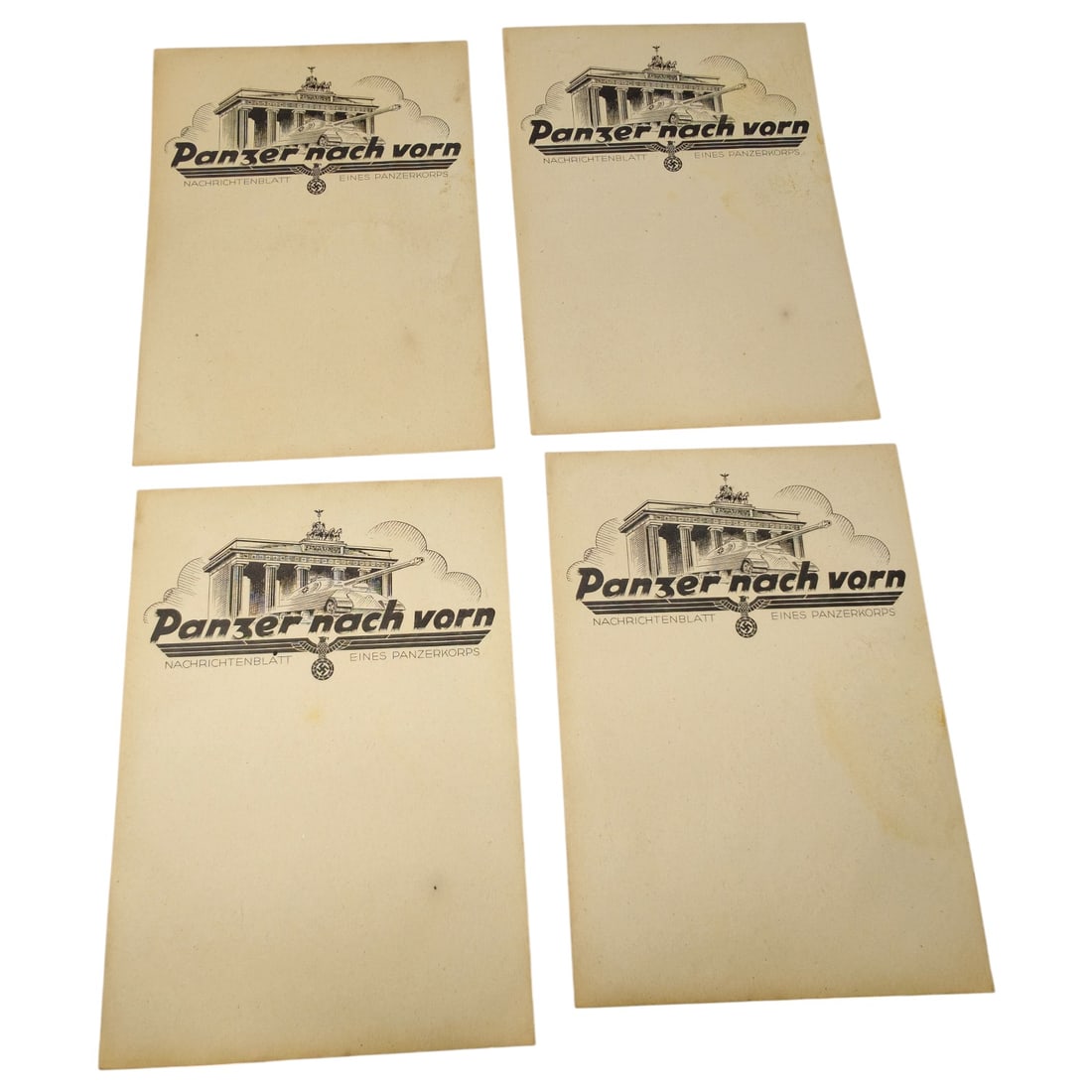 German WWII Blank Letterhead Sheets - 'Panzer nach vorn' Panzerkorps Nachrichtenblatt: A set of blank letterhead sheets printed with the illustrated masthead "Panzer nach vorn" ("Tanks Forward"), subtitled "Nachrichtenblatt eines Panzerkorps" (News Sheet of a Panzer Corps). The design d