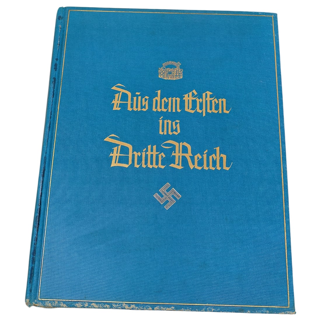 German WWII Book "Aus dem Ersten ins Dritte Reich": A hardbound cigarette-card style album titled "Aus dem Ersten ins Dritte Reich" ("From the First into the Third Reich"), bound in blue cloth with gilt Gothic-script lettering and a swastika device on 