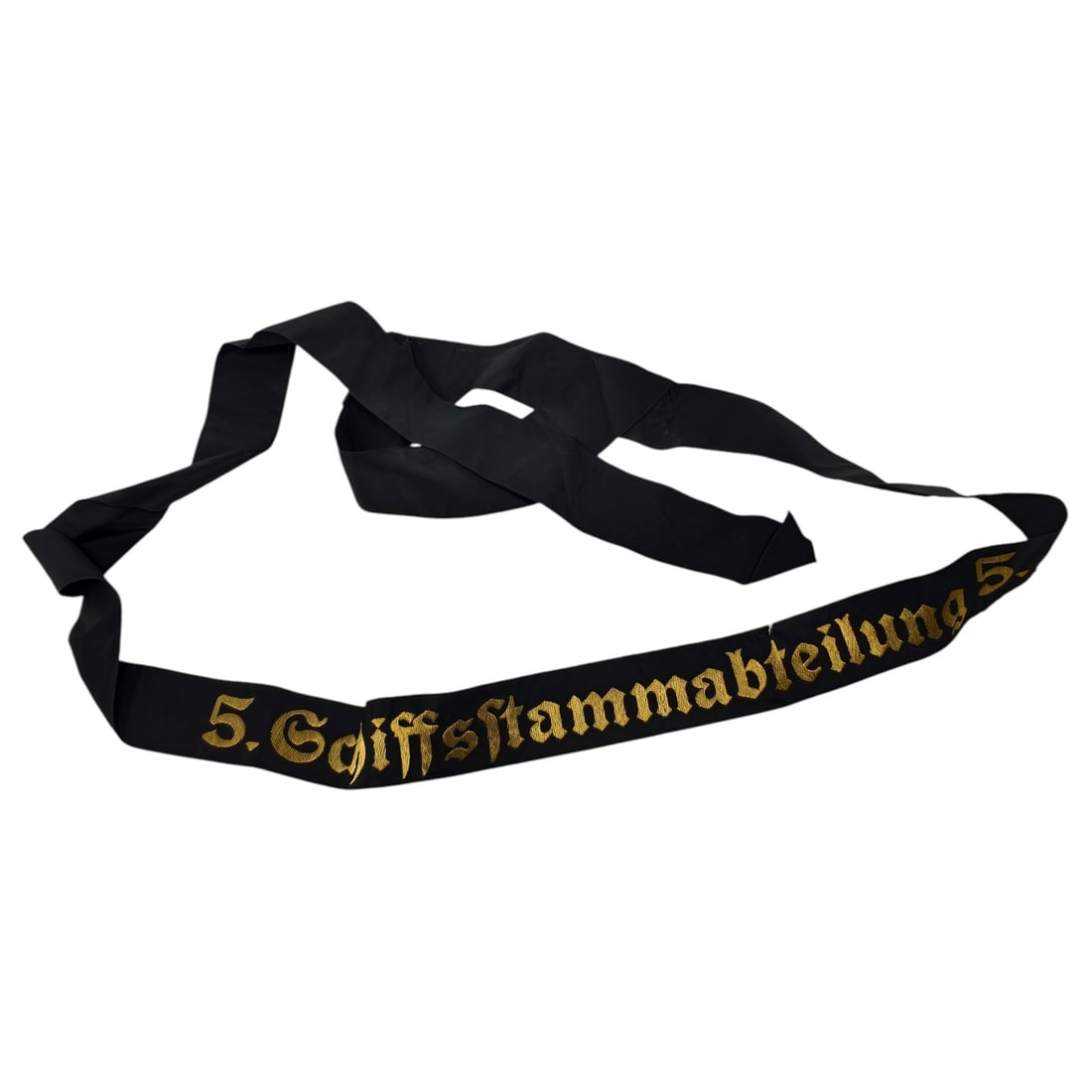 German Kriegsmarine Cap Tally "5. Schiffsstammabteilung 5.": A black ribbon cap tally (Mützenband) with the unit designation "5. Schiffsstammabteilung 5." woven in gold-toned Gothic lettering across the front section. The ribbon is worn wrapped around a sa