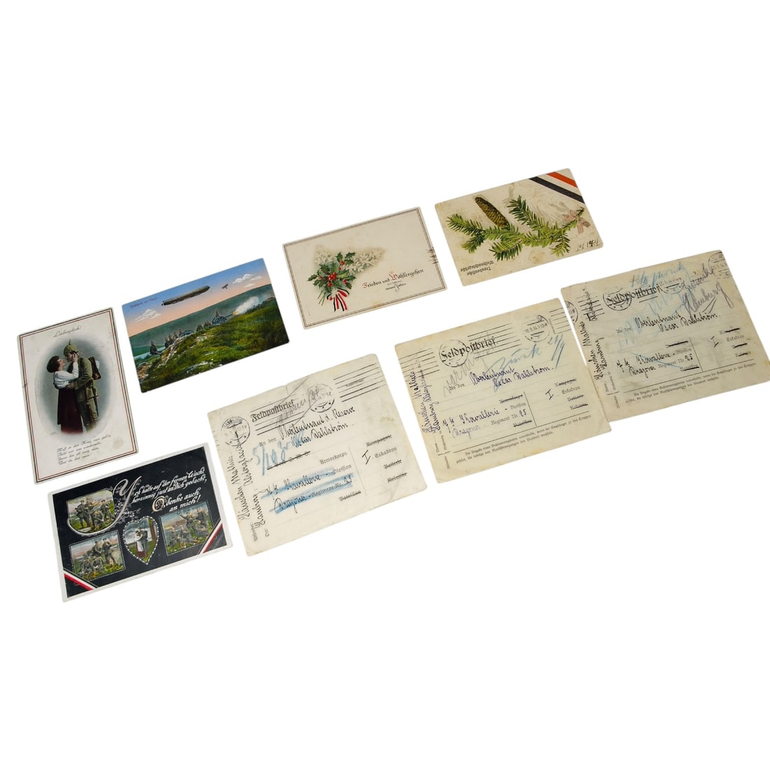Imperial German WWI Feldpostbriefe and Postcard Set: A set of German field post letters (Feldpostbrief/Feldpostkarte) and greeting postcards from the First World War period. The Feldpostbriefe carry printed letterhead text, unit designations, and handwr